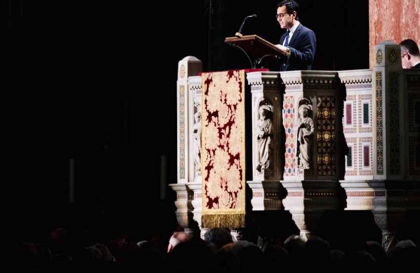 Rehman giving reading at Westminster Cathedral