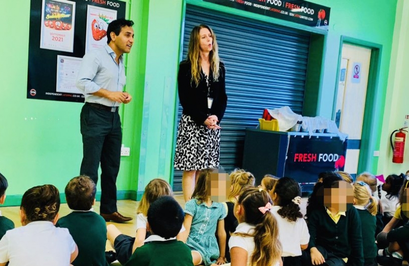 Rehman speaking to pupils