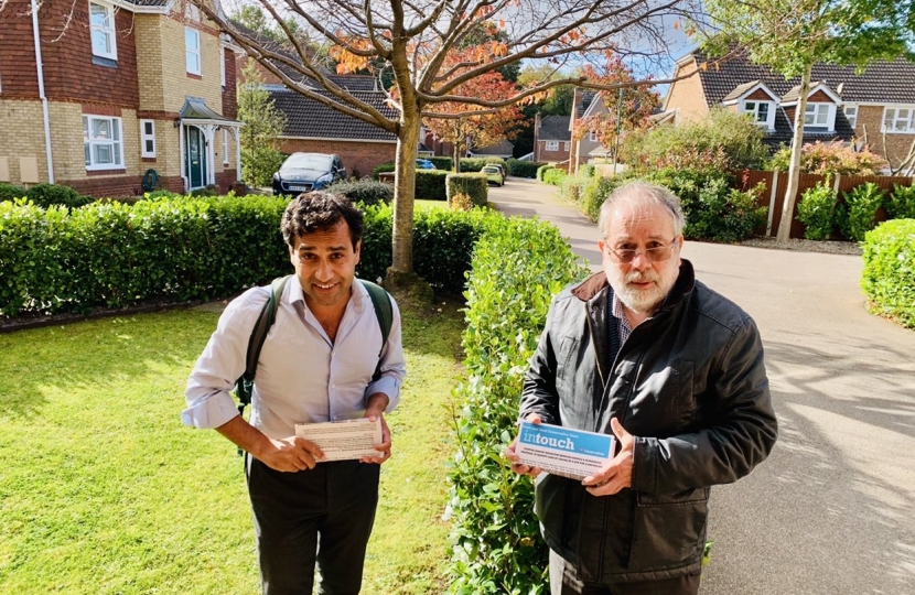 Rehman with Cllr Barrett delivering leaflet