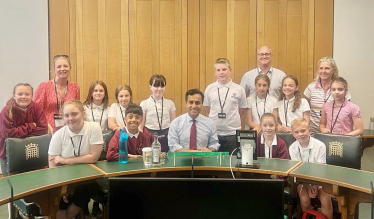 Rehman with students from Parkwood Primary School
